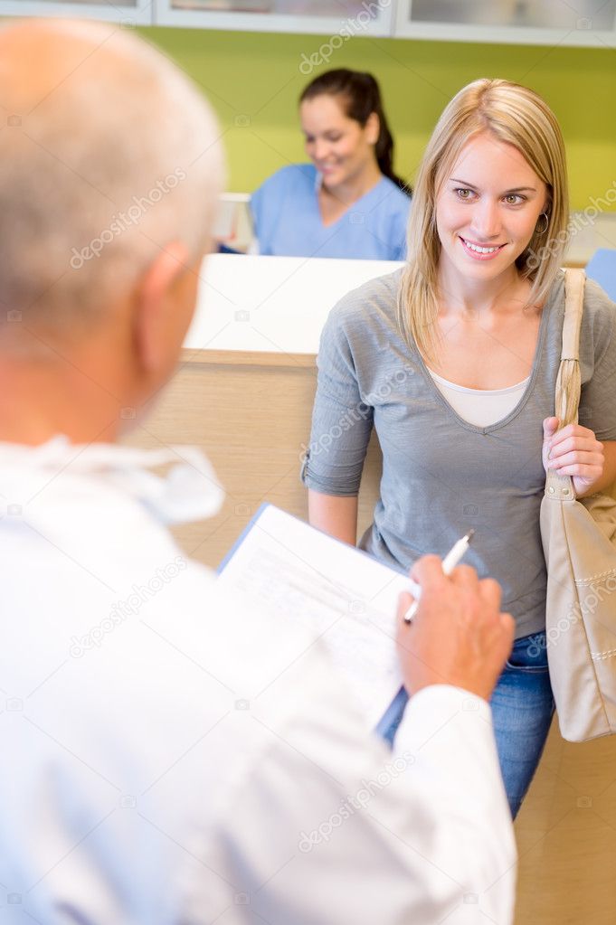 Dentist calling next patient for dental checkup