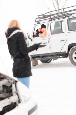 Woman having trouble with car snow assistance clipart