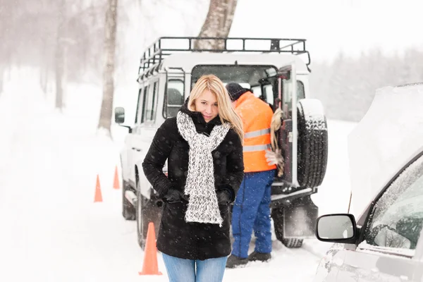 Mechanic helping woman with broken car snow Royalty Free Stock Images