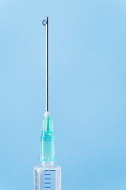 Medical syringe drop falling from needle clipart