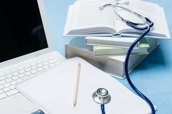 Medical research stethoscope lying on doctor book — Stock Photo, Image