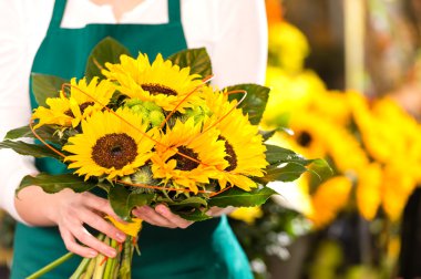Bouquet sunflowers flower shop female florist holding clipart