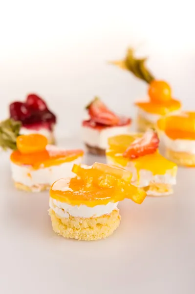 Mini fruit tarts choice creamy desserts — Stock Photo, Image