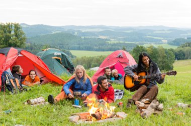 Camping students listening girl with guitar tents clipart