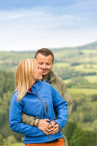 Lovely young couple hugging with scenic view — Stock Photo, Image