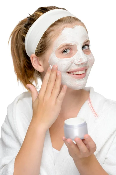 Aplicando mascarilla facial dedos sonriente chica rubia — Foto de Stock