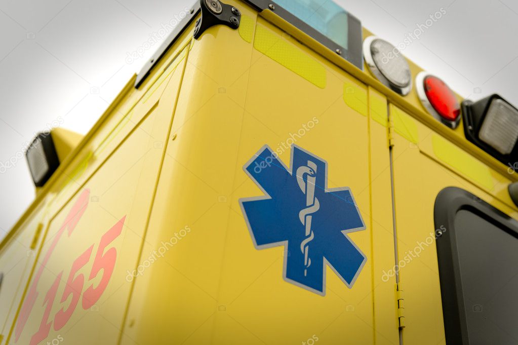 Blue star paramedic symbol and phone number on emergency truck