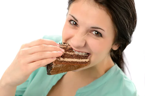 Mujer joven codiciosa comiendo sabroso pastel —  Fotos de Stock