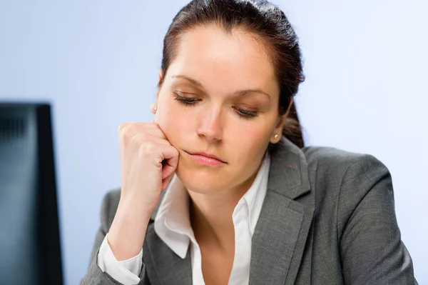 Bored female office employee at work — Stock Photo, Image