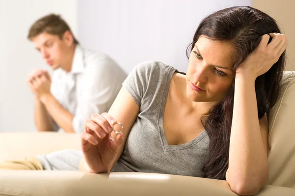 Sad wife looking at her ring — Stock Photo, Image