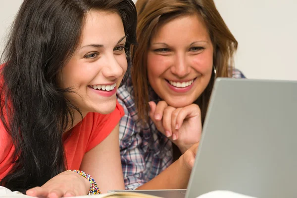 Joyful teens browsing on internet Stock Picture