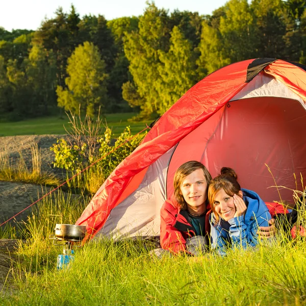 Young couple camping lying in tent — Stock Photo, Image