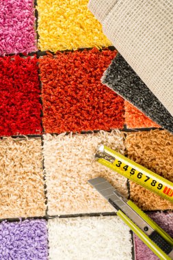 Carpet swatches, tape measure, boxcutter clipart