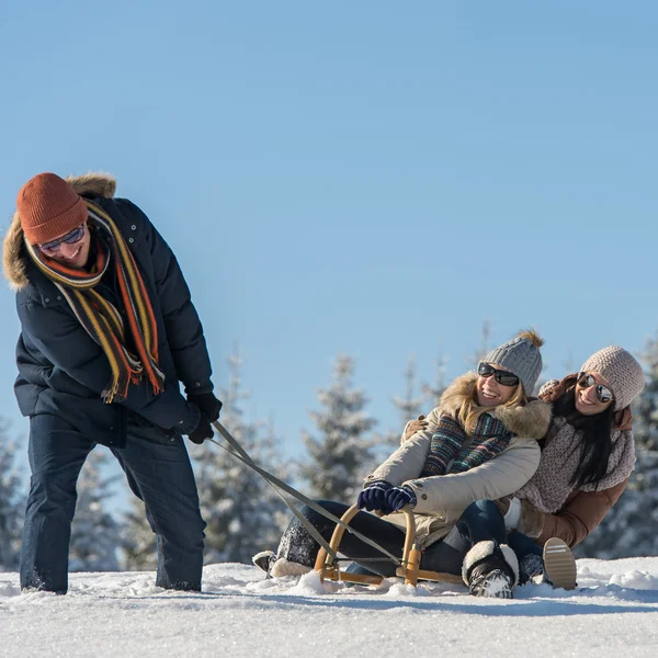 Friends having fun on sledge sunny winter — Stock Photo, Image