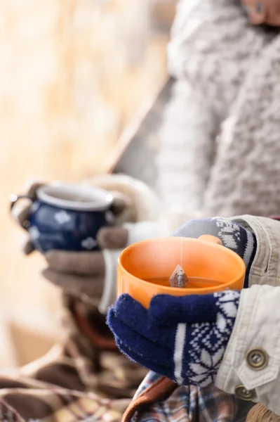 Steaming cups of tea winter hands holding — Stock Photo, Image