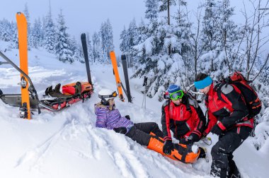 Ski patrol team rescue woman broken leg clipart