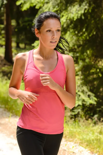 Jogging woman close-up running in countryside Royalty Free Stock Images