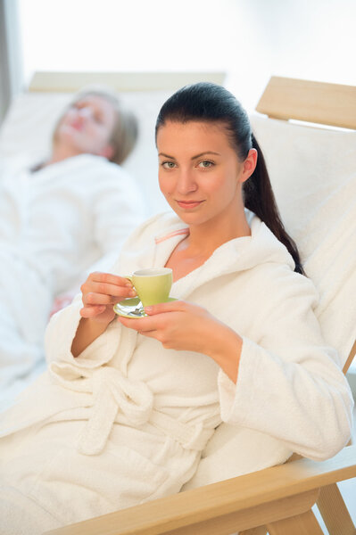 Woman enjoy coffee in spa