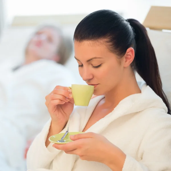 Woman drink coffee at spa — Stock Photo, Image