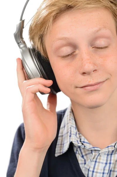 Relaxed teenage boy enjoying music — Stock Photo, Image