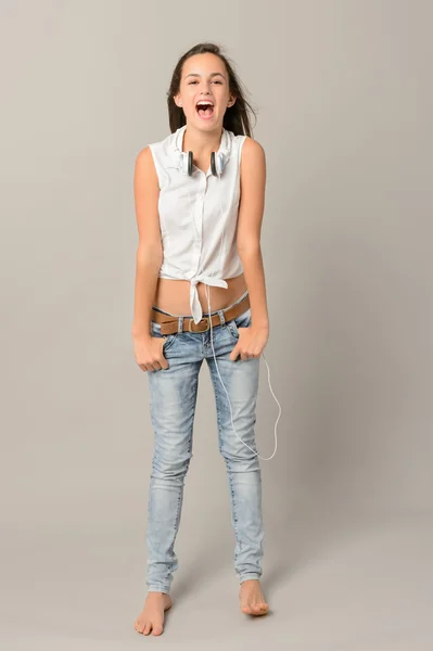 Singing teenage girl with headphones — Stock Photo, Image