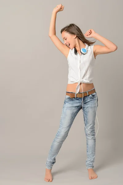 Teenage girl dancing enjoying music — Stock Photo, Image