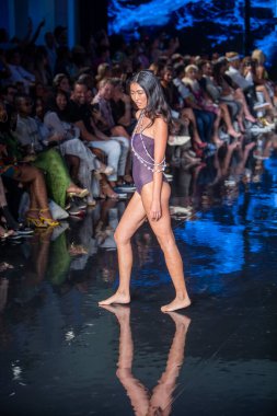 A model walks the runway for Indigo Wild Swim Fashion Show during Art, Hearts, Fashion Swim Week at the Faena Forum in Miami Beach on 7- 9- 2021