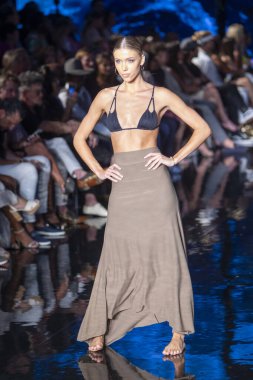 A model walks the runway for Indigo Wild Swim Fashion Show during Art, Hearts, Fashion Swim Week at the Faena Forum in Miami Beach on 7- 9- 2021