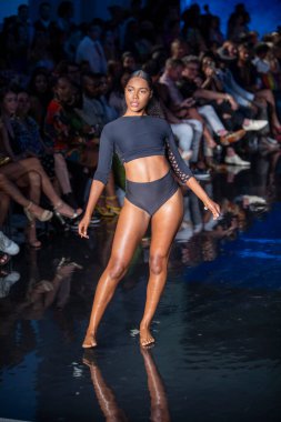 A model walks the runway for Indigo Wild Swim Fashion Show during Art, Hearts, Fashion Swim Week at the Faena Forum in Miami Beach on 7- 9- 2021