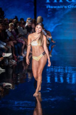 A model walks the runway for Indigo Wild Swim Fashion Show during Art, Hearts, Fashion Swim Week at the Faena Forum in Miami Beach on 7- 9- 2021