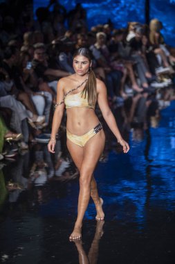 A model walks the runway for Indigo Wild Swim Fashion Show during Art, Hearts, Fashion Swim Week at the Faena Forum in Miami Beach on 7- 9- 2021
