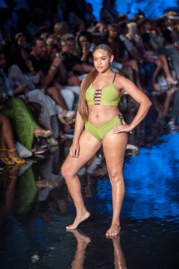 A model walks the runway for Indigo Wild Swim Fashion Show during Art, Hearts, Fashion Swim Week at the Faena Forum in Miami Beach on 7- 9- 2021