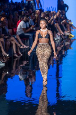 A model walks the runway for Matte Collection Swimwear Fashion Show during Art, Hearts, Fashion Swim Week at the Faena Forum in Miami Beach on 7- 9- 2021