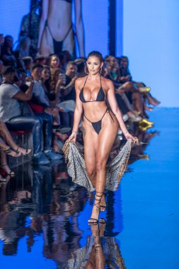 A model walks the runway for Matte Collection Swimwear Fashion Show during Art, Hearts, Fashion Swim Week at the Faena Forum in Miami Beach on 7- 9- 2021