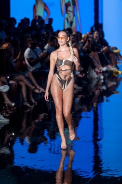 A model walks the runway for Matte Collection Swimwear Fashion Show during Art, Hearts, Fashion Swim Week at the Faena Forum in Miami Beach on 7- 9- 2021