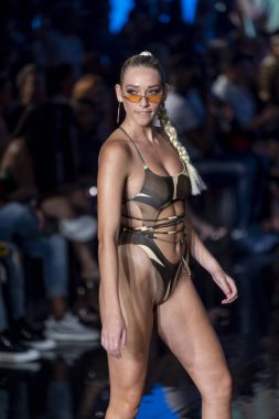 A model walks the runway for Matte Collection Swimwear Fashion Show during Art, Hearts, Fashion Swim Week at the Faena Forum in Miami Beach on 7- 9- 2021