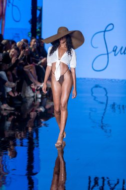 A model walks the runway for Matte Collection Swimwear Fashion Show during Art, Hearts, Fashion Swim Week at the Faena Forum in Miami Beach on 7- 9- 2021