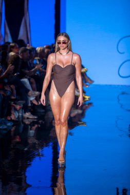 A model walks the runway for Matte Collection Swimwear Fashion Show during Art, Hearts, Fashion Swim Week at the Faena Forum in Miami Beach on 7- 9- 2021