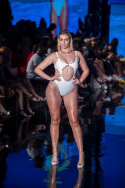 A model walks the runway for Matte Collection Swimwear Fashion Show during Art, Hearts, Fashion Swim Week at the Faena Forum in Miami Beach on 7- 9- 2021