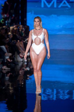 A model walks the runway for Matte Collection Swimwear Fashion Show during Art, Hearts, Fashion Swim Week at the Faena Forum in Miami Beach on 7- 9- 2021