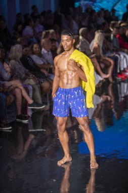 A model walks the runway for the Vilebrequin Fashion Show during Art, Hearts, Fashion Swim Week at the Faena Forum in Miami Beach on 7- 10- 2021