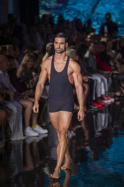 A model walks the runway for the Vilebrequin Fashion Show during Art, Hearts, Fashion Swim Week at the Faena Forum in Miami Beach on 7- 10- 2021