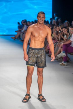 A model walks the runway for The Miami International University of Art and Design Fashion Show during Paraiso Swim Week 2022 at Miami Beach on July 21st, 2022