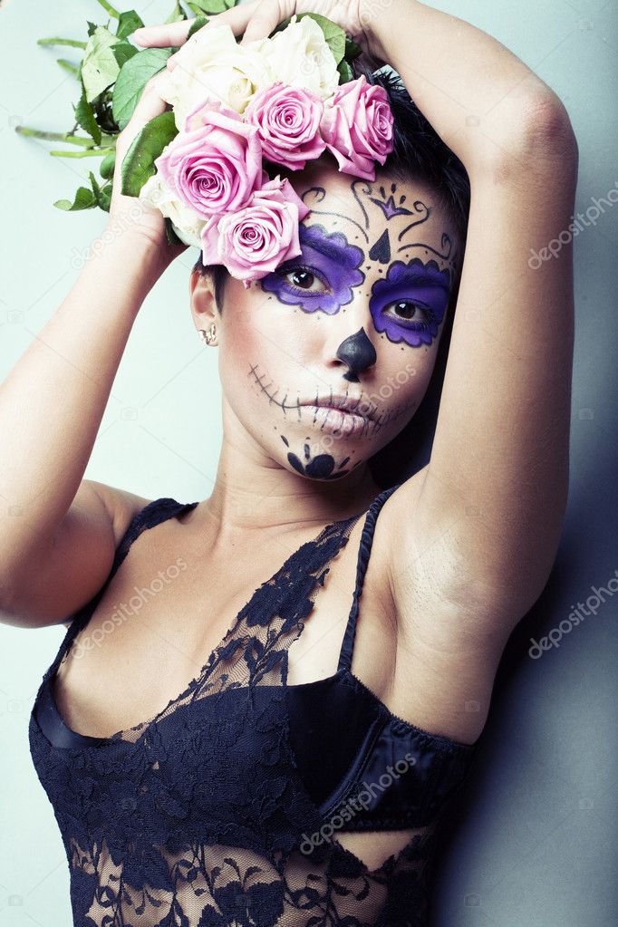 Girl with the strange makeup with flowers