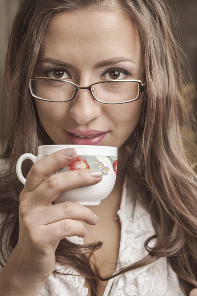 Beautiful girl drinking tea