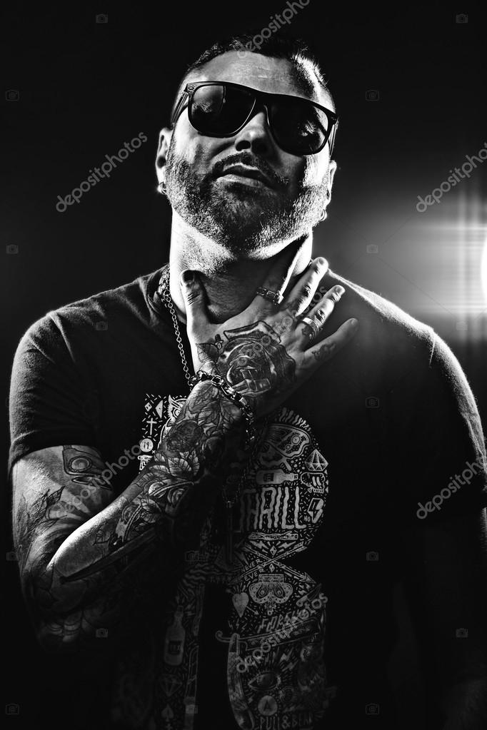 Black and white photo of a handsome man in tattoos Stock Photo by  ©citrusss08 46001003