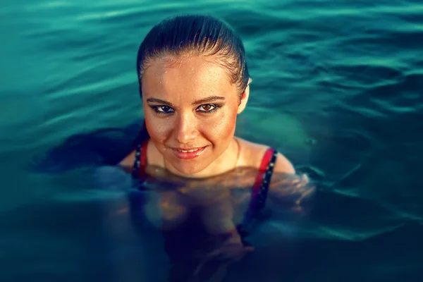 Beautiful brunette woman deep in the sea — Stock Photo, Image