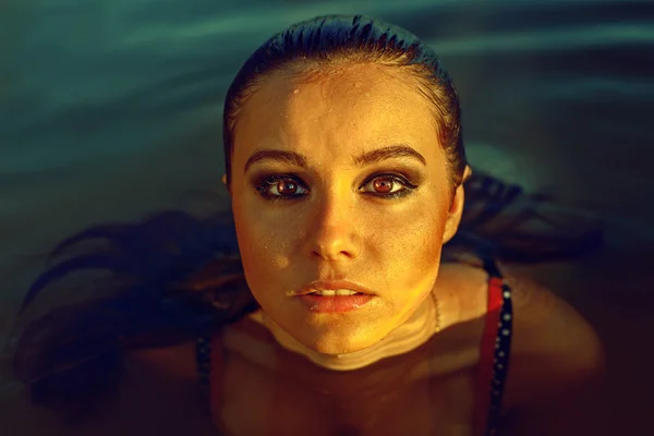 Beautiful brunette woman deep in the sea — Stock Photo, Image