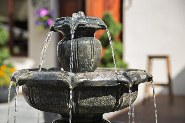 Unique fountain erupting some water at day