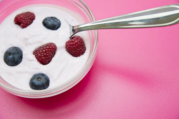 Bowl with jogurt and chromed spoon in — Stock Photo, Image